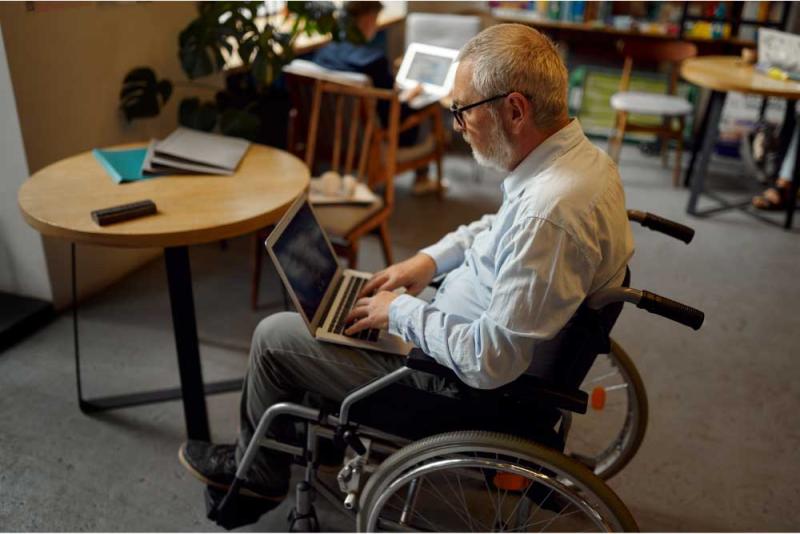 Man with disabilities using a laptop